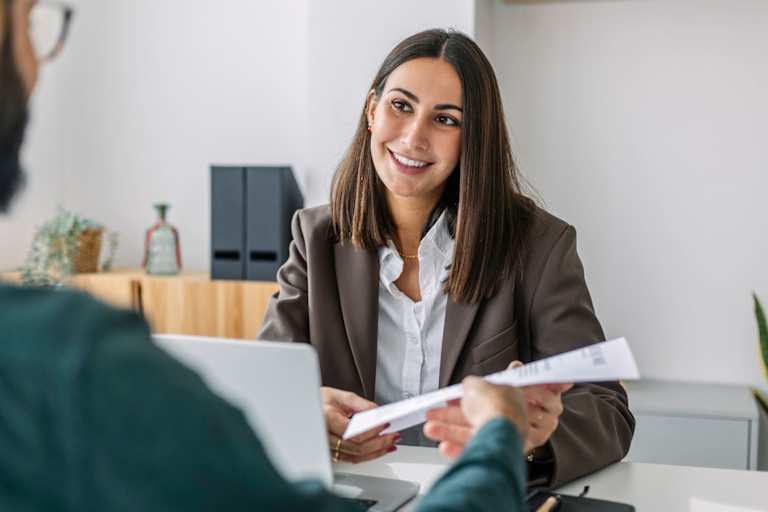 Human resources manager talks to employee