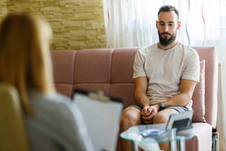 Athlete speaking to sports psychologist in office